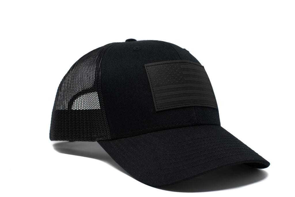 Black trucker hat with black leather American flag patch