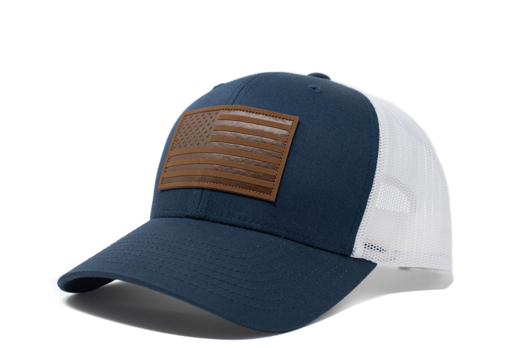 Navy trucker hat with brown leather American flag patch
