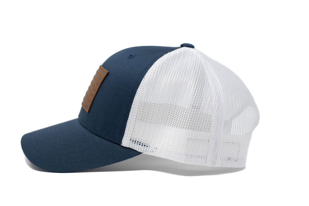 Navy trucker hat with brown leather American flag patch
