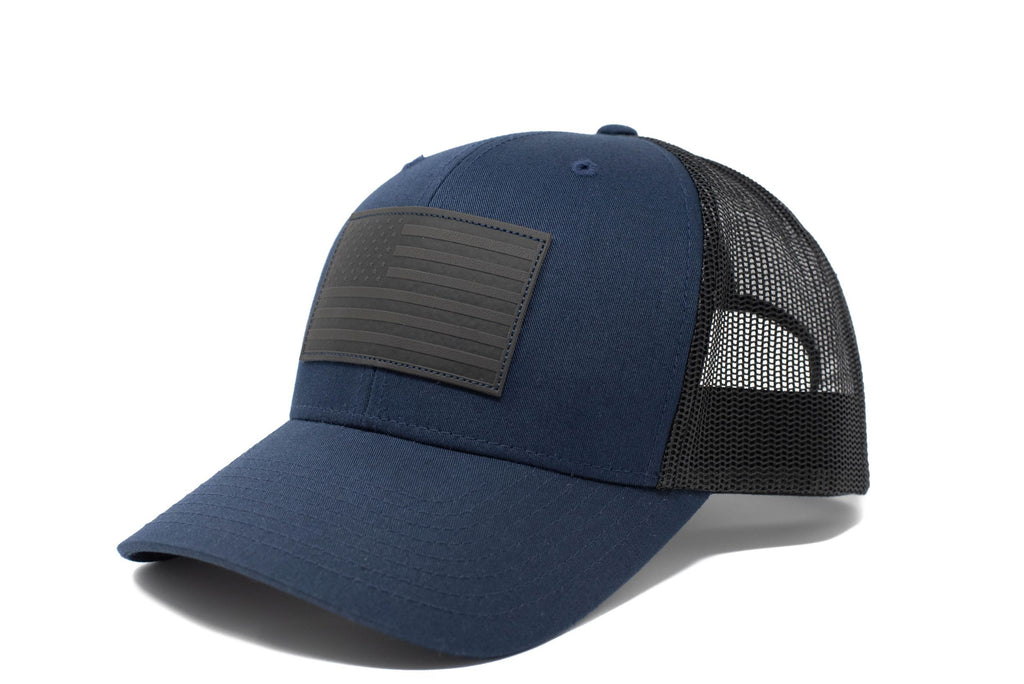 Dark blue trucker hat with black leather American flag patch