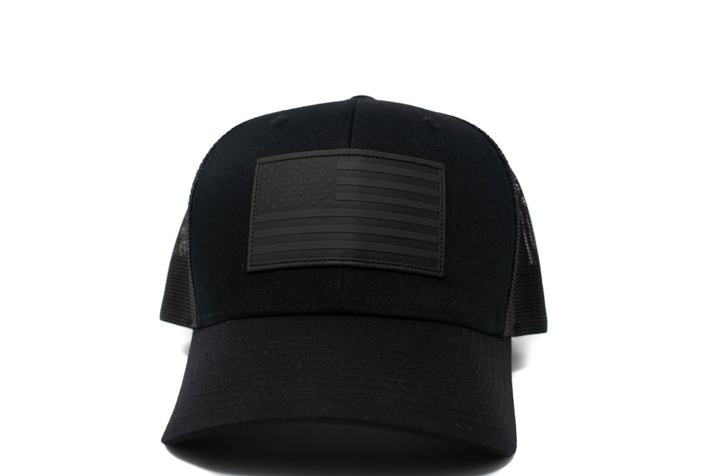 Black trucker hat with black leather American flag patch
