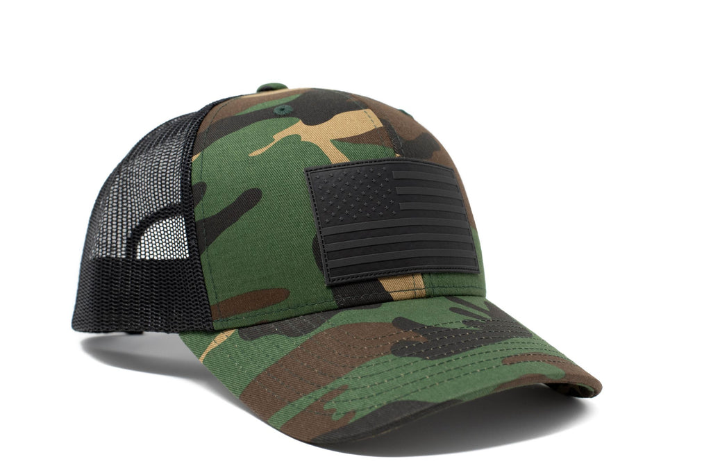 Woodland Camo trucker hat with black leather American flag patch