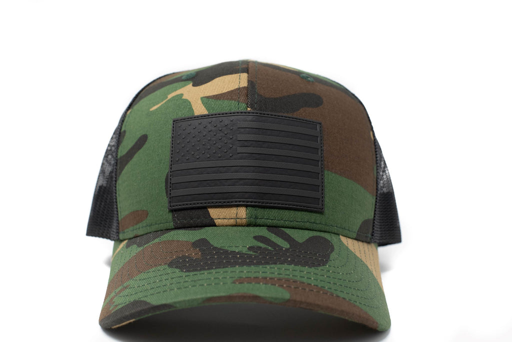 Woodland Camo trucker hat with black leather American flag patch