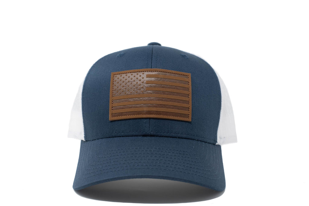 Navy trucker hat with brown leather American flag patch